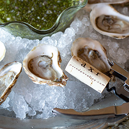 Oysters on ice with an AXR cork nearby