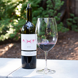 Bottle and glass of AXR sleeping lady Cabernet Savignon outdoors